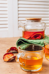 Bael fruit juice or quince tea and dried bael sliced fruit on rustic background. Thai or Asian healthy drink. Bael is helping the body to resist catching a cold.