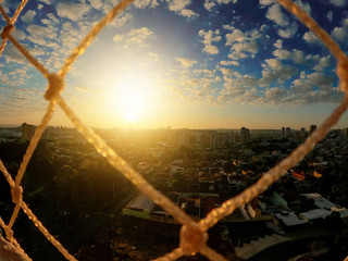 Sunrise in quarantine. Sky background with grids