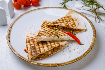 Mexican Quesadilla with chicken on white table