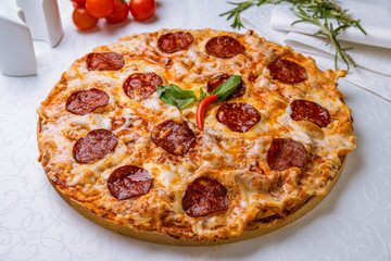 Pepperoni pizza on white table