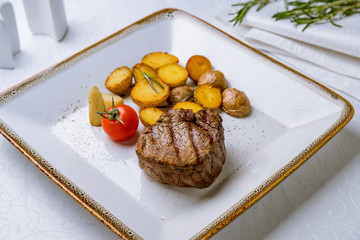 grilled steak filet Mignon with baked mini potatoes