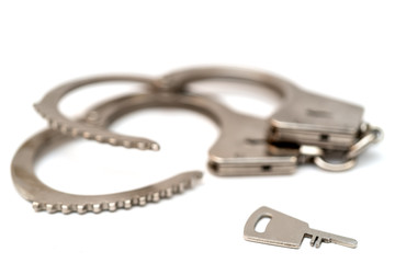 Metal handcuffs. Detention of criminals breaking  law. Restriction of freedom.