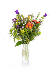 Colorful bouquet of mixed flowers in a vase, isolated on a white background
