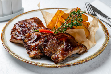 Barbecue pork ribs on white table