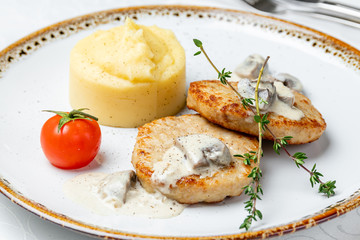 Chicken cutlets with mashed potatoes and mushroom sause