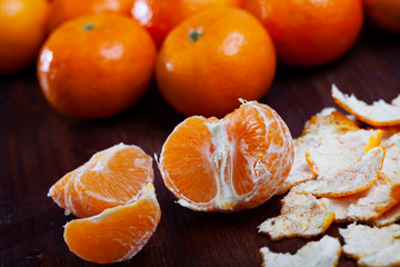 Clementines on dark wooden background © JackF