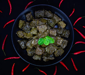 Uzbek traditional dish green pilaf in bag on white plate. Classic central asian Bukharian jewish cuisine.