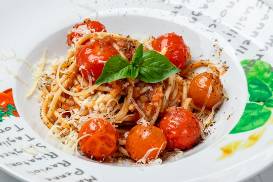 Pomodoro spaghetti with tomatoes on white table