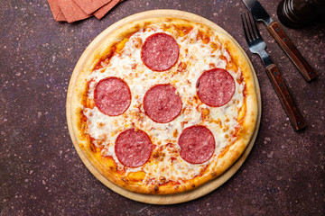 Pepperoni pizza on concrete table top view