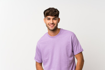 Young handsome man over isolated white background laughing