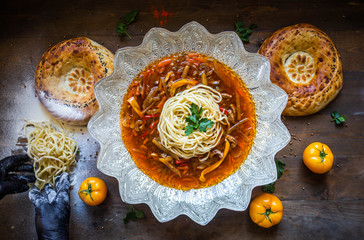 Uzbek traditional dish green pilaf in bag on white plate. Classic central asian Bukharian jewish cuisine.