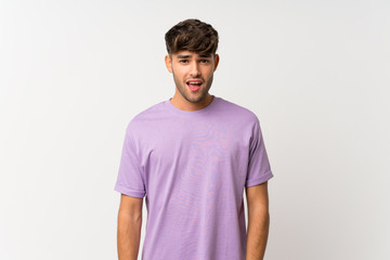 Fototapeta premium Young handsome man over isolated white background with surprise facial expression