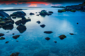 Fototapeta na wymiar Reflection of Sunset on Salt Pond Beach, Salt Pond Park, Kauai,Hawaii, USA