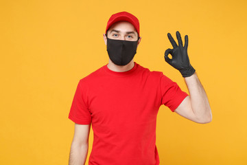 Delivery man in red cap blank t-shirt uniform sterile face mask gloves isolated on yellow background studio Guy employee working courier Service quarantine pandemic coronavirus virus 2019-ncov concept