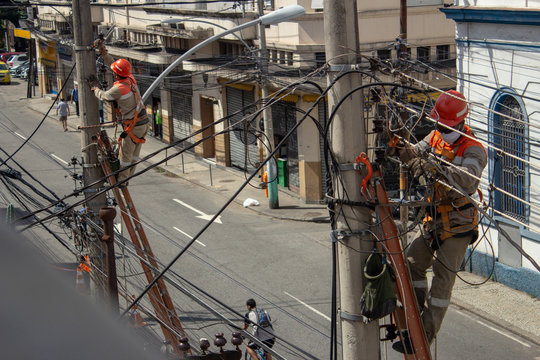 Men Repairing Electrical Grid Wires Using Masks Because Of COVID-19