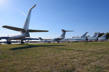 Fototapeta na wymiar Transport aircrafts and light planes parked in the park of the air show