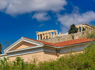Fototapeta premium Athens Greece, parthenon temple on acropolis hilll and partiail view of neoclassiccal building pediment
