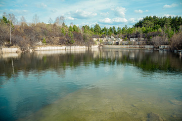 Flooded marble quarry in spring