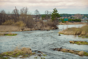 River, dry grass on the banks