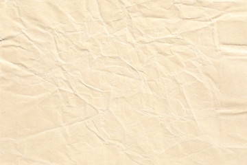 Old pale yellow crumpled paper background texture