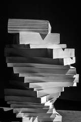 swirl of stack of books in black and white closeup