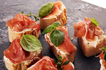 Iberico ham sandwich with homemade bread baked in wood oven or jamon sandwich with local herbs