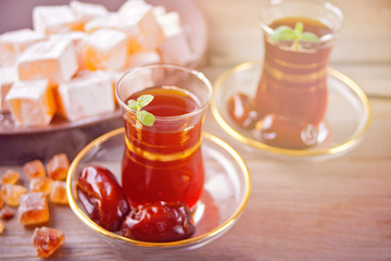 Turkish tea in traditional glass cups on the tray. Ramadan, Eid concept.