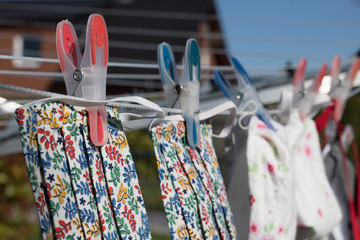 handmade face mask on clothes line to wear in corona crisis - Powered by Adobe