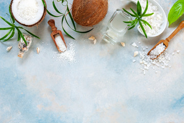 Beautiful SPA concept composition with coconut body care products on blue sky background