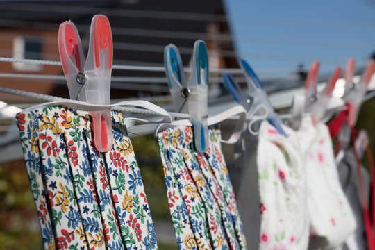 handmade face mask on clothes line to wear in corona crisis