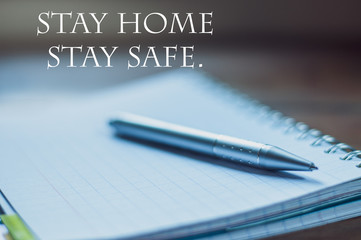 Stay Home Stay safe,concept ,pen on notebook,background