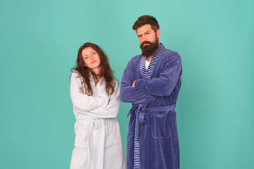 Being soft and cozy. Couple in love feel cozy in bathrobes. Sexy girl and bearded man relax in cozy wear. Home clothing for comfort. Leisure or slumber wear. Bedtime or morning time. Cozy home