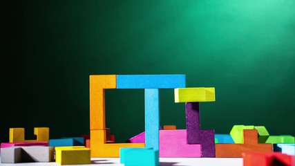 House is building with colourful wooden blocks, stop motion, animation. The concept of logical thinking. - Powered by Adobe