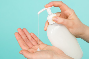 Hygiene concept. Closeup picture of woman's hands in a soap and sanitiser