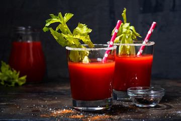 alcoholic cocktail bloody mary in glasses on dark background