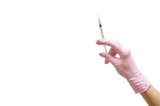 Female hand in a glove with a hypodermic syringe