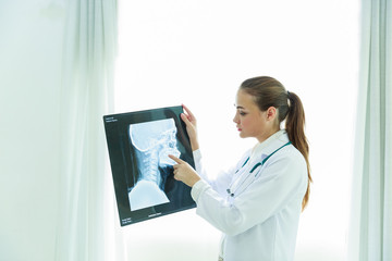 Medical concept in hospital, a doctor is checking health of a patient and analysis with x-ray to be resolve the problem, Healthy and medical background with copy space.