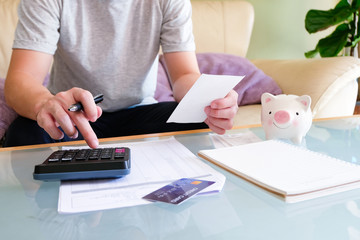 Men hold invoice, happy moment from budget control over personal expense, good financial status.  Individual budget plan for saving and growing the money. Household economic improvement concept.