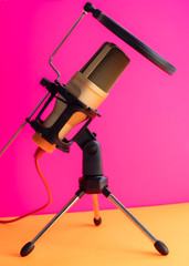 microphone for podcasting in a fuchsia background