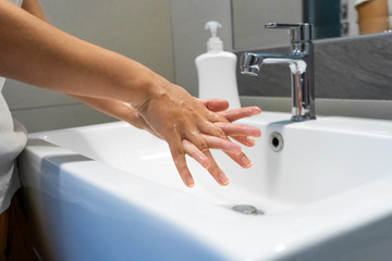 Fototapeta premium Washing hands rubbing with soap woman for corona virus prevention, hygiene to stop spreading coronavirus