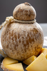 Italian semi hard matured caciocavallo cheese, handmade and aged in natural underground caves in...