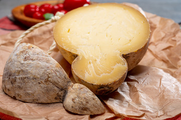 Italian semi hard matured caciocavallo cheese, handmade and aged in natural underground caves in Apulia region