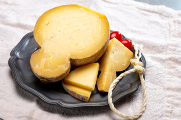 Italian semi hard matured caciocavallo cheese, handmade and aged in natural underground caves in...