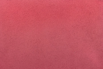 Rough red wall texture background.