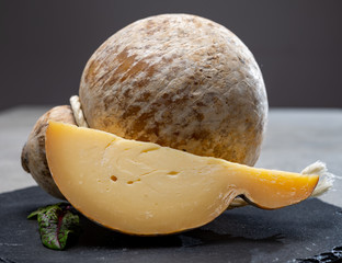 Italian semi hard matured caciocavallo cheese, handmade and aged in natural underground caves in...