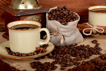 freshly ground and brewed black coffee in a brown cup