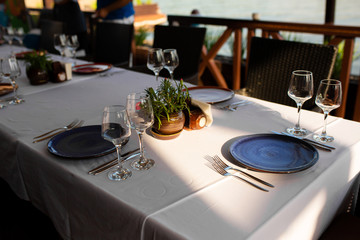 Stylish table setting in an open-air restaurant.