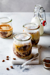 Healthy cappuccino, coffee latte chia pudding with milk foam in a glass jar. Vegan healthy breakfast, clean eating.