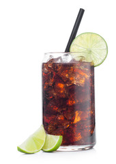 Cuba Libre Cocktail in tin shape glass with ice cubes and slices of lime with straw on white with raw limes.