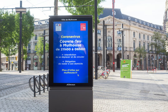 Mulhouse - France - 26 April 2020 - View of  the information panel against the coronavirus epidemic contagion wiith the curfew during the night
